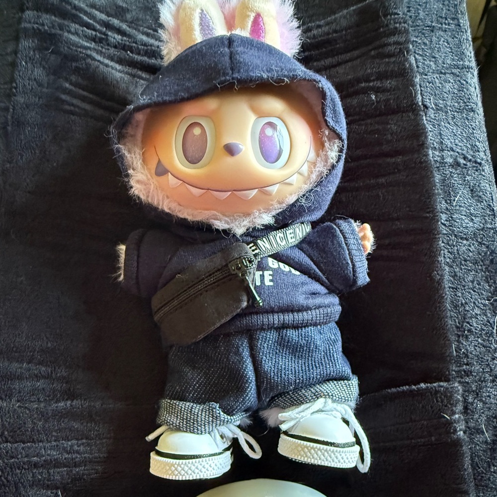 Pop mart labubu big into energy “luck” with custom outfit and Jason mask.